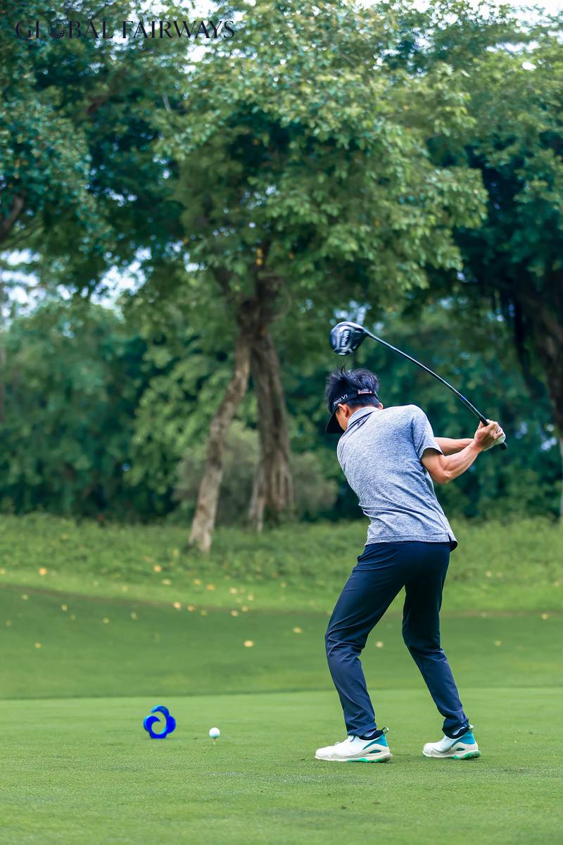 A player taking a golf swing